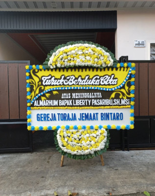 Papan Bunga Duka di Rufaer